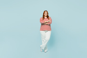 Full body smiling fun happy young chubby overweight woman wearing striped red shirt casual clothes...