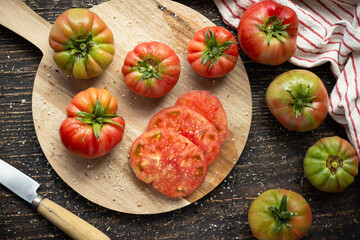 Fresh tomatoes on wooden board, top view, horizontal..healthy food concept. Summer salad.