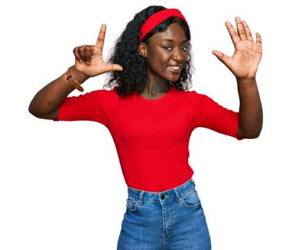 Beautiful african young woman wearing casual clothes showing and pointing up with fingers number seven while smiling confident and happy.