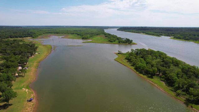 Aerial video of Lake Whitney in Texas.  Shot in Plowman Creek Park, camera rises up to reveal the Brazos river flowing into Lake Whitney.