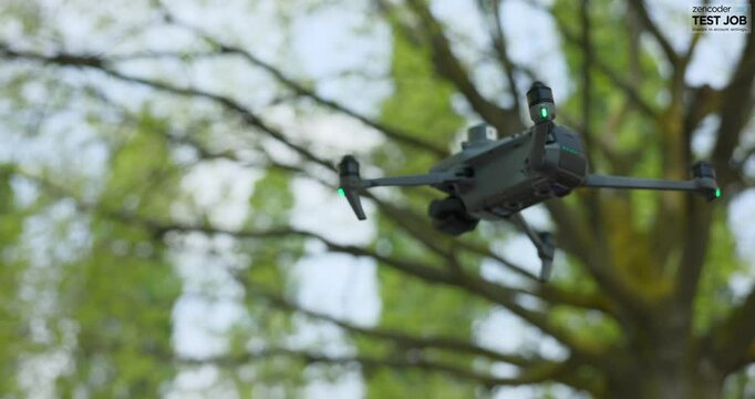 Low angle close up view of DJI Mavic 3E enterprise drone for photogrammetry flying with trees in background