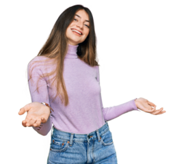 Young beautiful teen girl wearing turtleneck sweater smiling cheerful with open arms as friendly welcome, positive and confident greetings