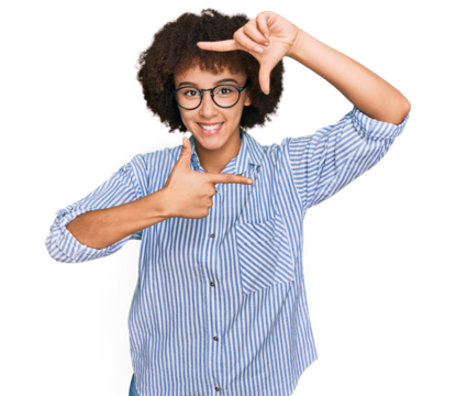 Young hispanic girl wearing business shirt and glasses smiling making frame with hands and fingers with happy face. creativity and photography concept.