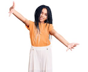 Cute african american girl wearing casual clothes looking at the camera smiling with open arms for hug. cheerful expression embracing happiness.