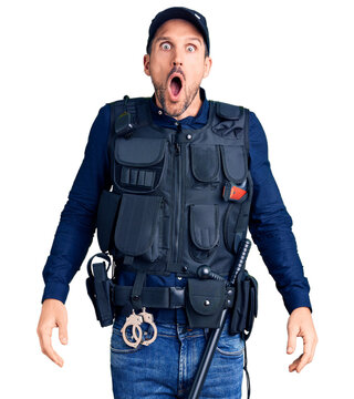 Young handsome man wearing police uniform afraid and shocked with surprise and amazed expression, fear and excited face.