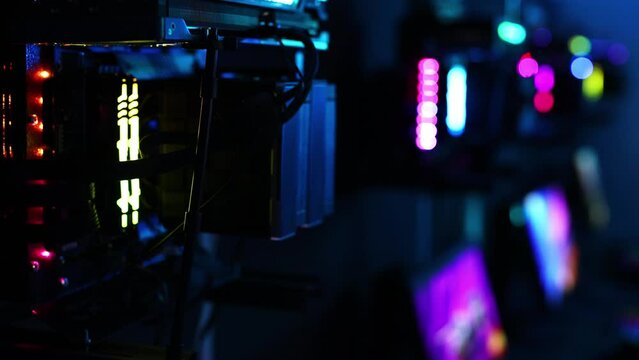 A top-end system unit for a gaming computer in close-up with neon illumination