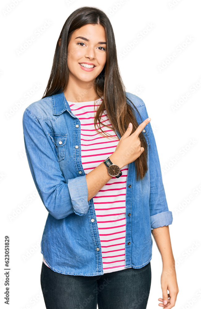 Poster young brunette woman wearing casual clothes cheerful with a smile on face pointing with hand and fin