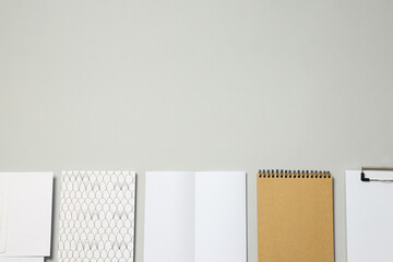 Mockup with copybooks and notebooks on gray background, space for text