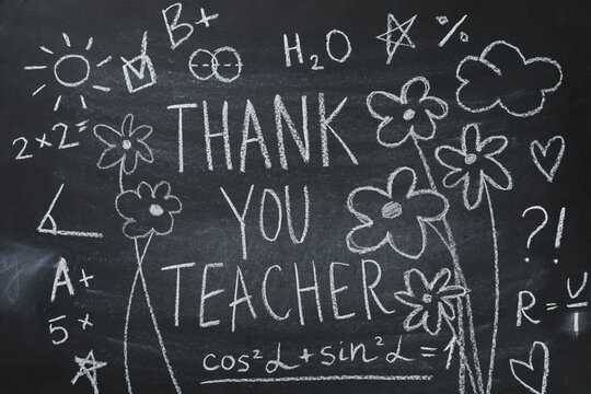 Black school board with chalk inscription "Thank you teacher!"