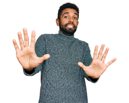 Young african american man wearing casual clothes afraid and terrified with fear expression stop gesture with hands, shouting in shock. panic concept.