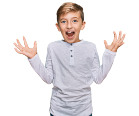 Little caucasian boy kid wearing casual clothes celebrating crazy and amazed for success with arms raised and open eyes screaming excited. winner concept