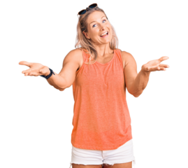 Middle age fit blonde woman wearing casual summer clothes and sunglasses smiling cheerful offering hands giving assistance and acceptance.