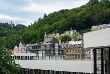 Beautiful buildings in traditional spa town of Karlovy Vary, Czech Republic. Traditional buildings of Karlovy Vary with the hills in the background.