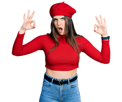 Young brunette teenager doing excellent gesture with hand in shock face, looking skeptical and sarcastic, surprised with open mouth