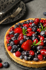 Grated cake with summer fruits. Blueberries, strawberries, raspberries. Macro photo.