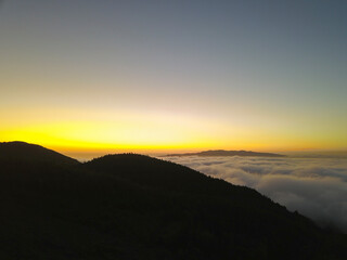 Sunset on the mountains above the clouds in the Fire Lake "Lagoa do Fogo " on the island of São Miguel in the Azores.