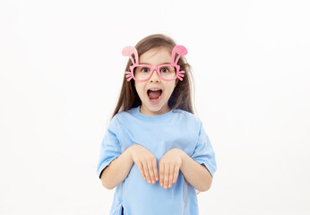 Cute little child girl wearing bunny ears glasses a on Easter day. Easter girl portrait on white background, funny emotions, surprise