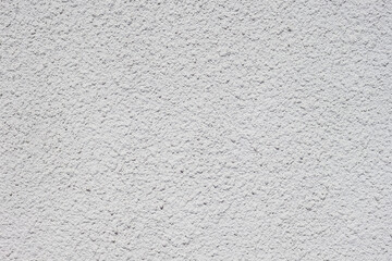 Texture of decorative plaster with a relief. White plaster. Close-up.