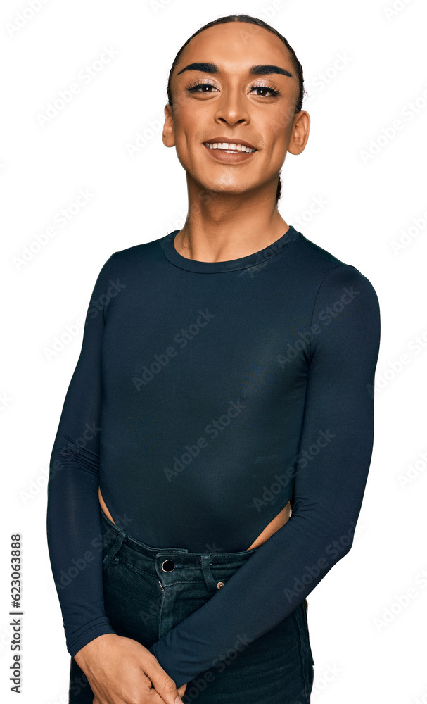 Wall mural Hispanic transgender man wearing make up and long hair wearing casual clothes looking positive and happy standing and smiling with a confident smile showing teeth