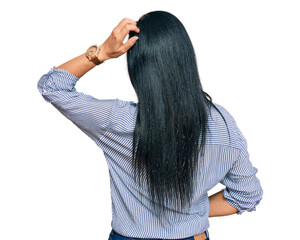 Young caucasian woman wearing casual clothes backwards thinking about doubt with hand on head