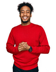 Young african american man with beard wearing casual winter sweater with hands together and crossed...