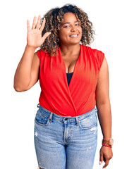 Young african american plus size woman wearing casual style with sleeveless shirt showing and pointing up with fingers number five while smiling confident and happy.