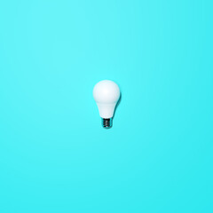 White Lightbulb With Turqoise Background