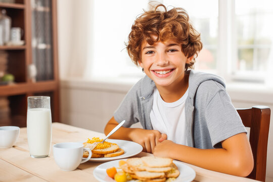 happy teenage boy eating breakfast. Healthy breakfast in the morning. Child eating breakfast. Generative AI