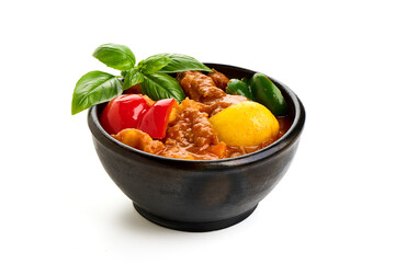 Hungarian goulash, pork stew, isolated on white background.