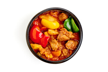 Hungarian goulash, pork stew, isolated on white background.