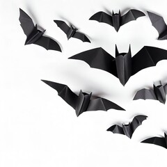 halloween and decoration concept - black paper bats flying over white background