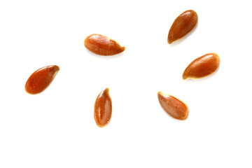 Linseed, flaxseed, linum seeds isolated on white. Healthy food pile background. Diet, vegetarian or clean eating concept. Macro close-up shot.