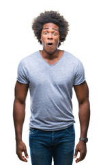 Afro american man over isolated background afraid and shocked with surprise expression, fear and excited face.