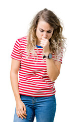 Fototapeta premium Beautiful young blonde woman over isolated background feeling unwell and coughing as symptom for cold or bronchitis. Healthcare concept.