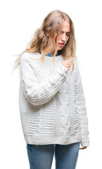 Beautiful young blonde woman wearing winter sweater over isolated background feeling unwell and coughing as symptom for cold or bronchitis. Healthcare concept.