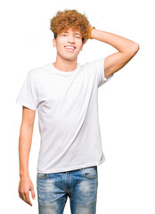 Young handsome man with afro hair wearing casual white t-shirt Smiling confident touching hair with hand up gesture, posing attractive