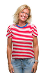 Fototapeta premium Middle age blonde woman over isolated background looking away to side with smile on face, natural expression. Laughing confident.