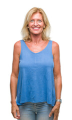 Fototapeta premium Middle age blonde woman over isolated background with a happy and cool smile on face. Lucky person.