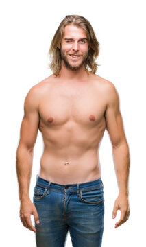 Young handsome shirtless man with long hair showing sexy body over isolated background winking looking at the camera with sexy expression, cheerful and happy face.