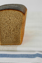Close-up of dark bread. Half a bread brick. high quality photo