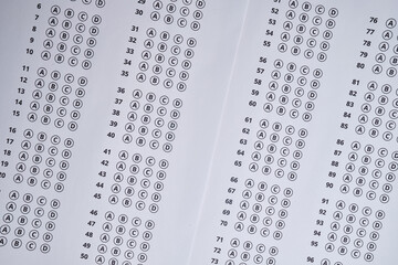 Admission test. Examination form. Choosing the correct answer. A sheet of paper with a test task. School exam. University quiz. Right or wrong option. Student to study. Elementary school question