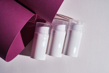 Container for cream, shampoo, toiletries, spa. Unbranded white plastic bottles. Bottle with a dispenser for cosmetic products. Skin care and beauty concept. Mockup style, copy space