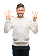 Young handsome man wearing winter sweater over isolated background showing and pointing up with fingers number eight while smiling confident and happy.