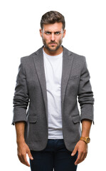 Fototapeta premium Young handsome business man over isolated background skeptic and nervous, frowning upset because of problem. Negative person.