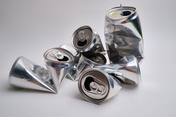 Crumpled empty empty soda or beer isolated on background. Crushed junk 
