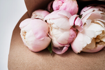 Bouquet of stylish peonies close-up. Pink peony flowers. Close-up of flower petals. Floral greeting card or wallpaper. Delicate abstract floral pastel background 