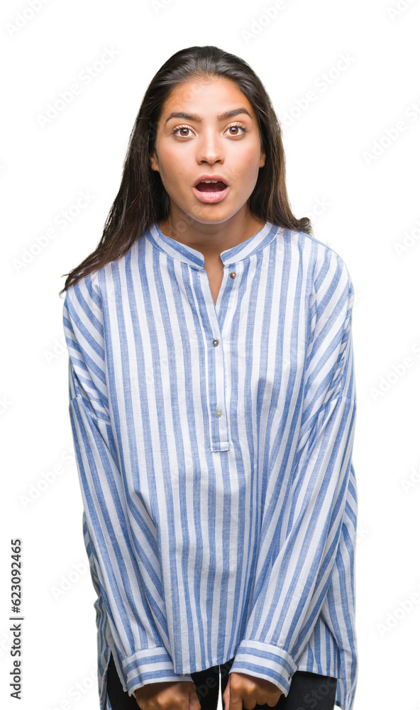 Poster Young beautiful arab woman over isolated background afraid and shocked with surprise expression, fear and excited face.