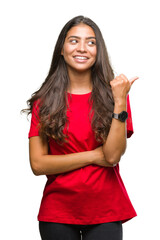 Young beautiful arab woman over isolated background smiling with happy face looking and pointing to...