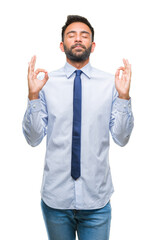 Adult hispanic business man over isolated background relax and smiling with eyes closed doing meditation gesture with fingers. Yoga concept.