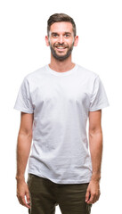 Obraz premium Young handsome man over isolated background with a happy and cool smile on face. Lucky person.